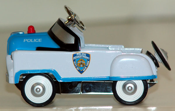 NYPD police cruiser pedal car (brown box)