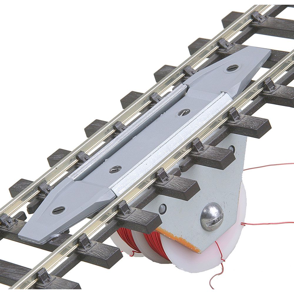 O Through-The-Track Delayed-Action Magne-Electric Uncoupler