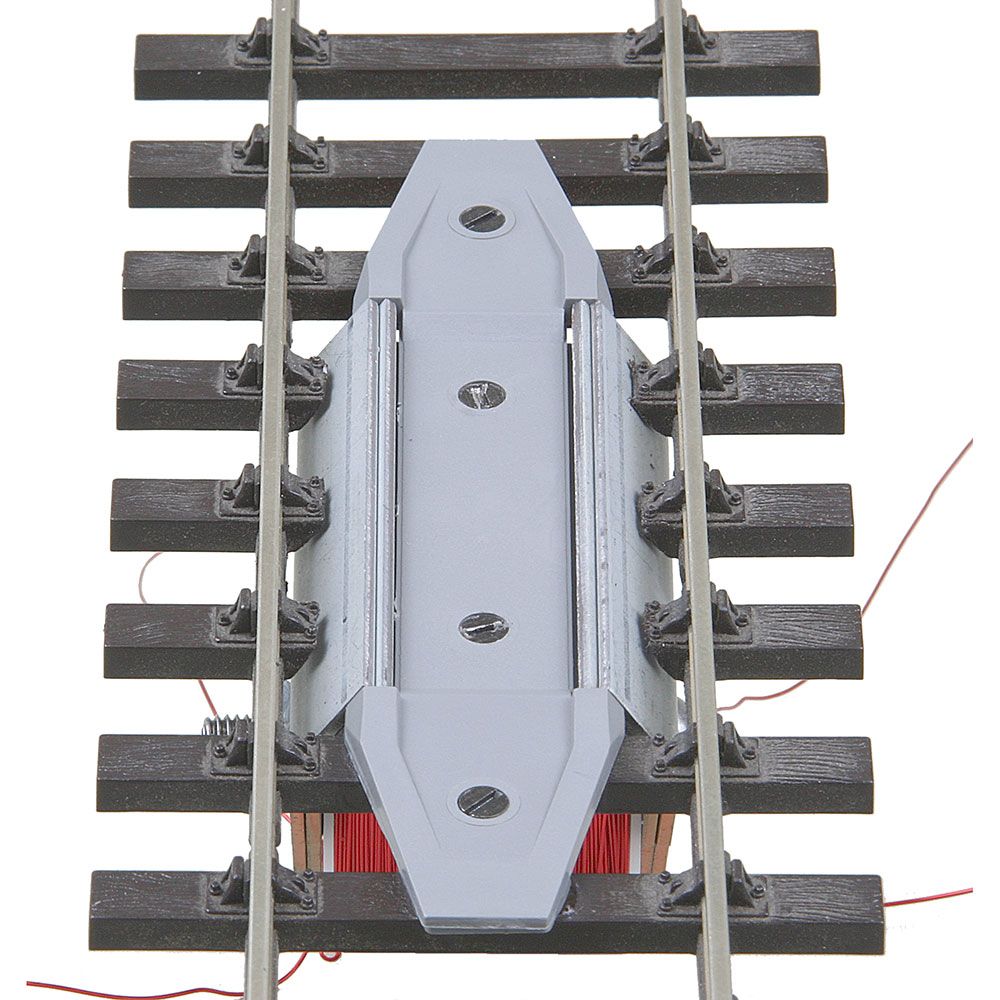 O Through-The-Track Delayed-Action Magne-Electric Uncoupler
