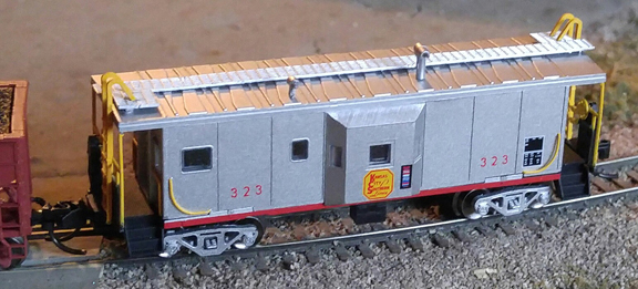 Kansas City Southern (silver) bay window caboose #323