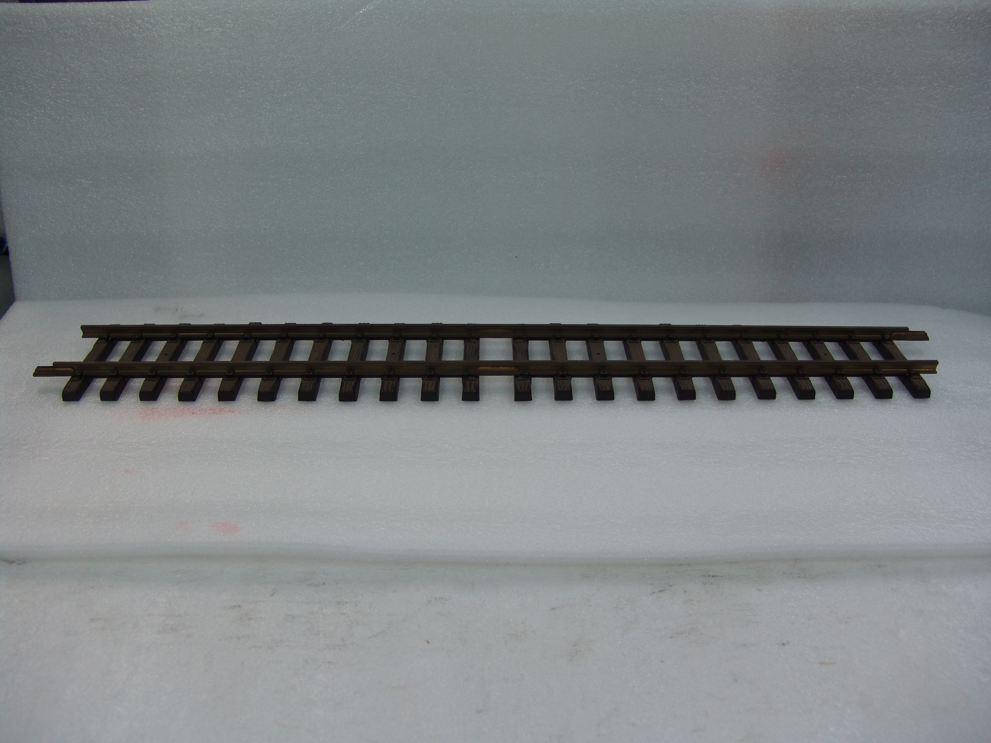 individual piece of #1060 600mm straight track used