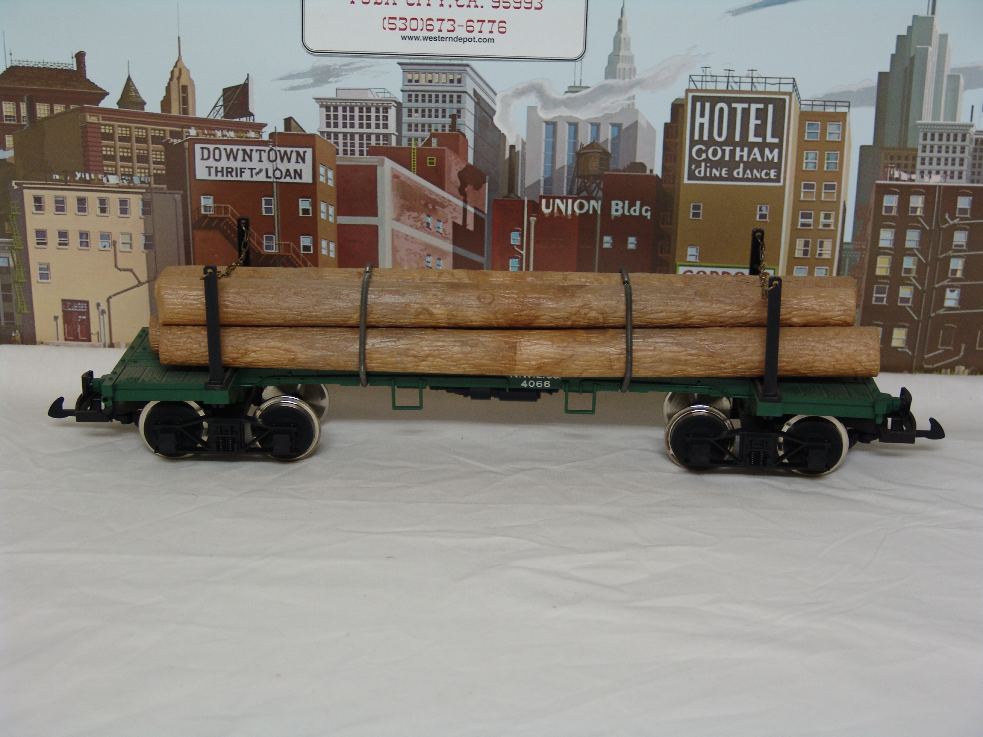 N.W.L. Co skeleton log car #4066 with log load