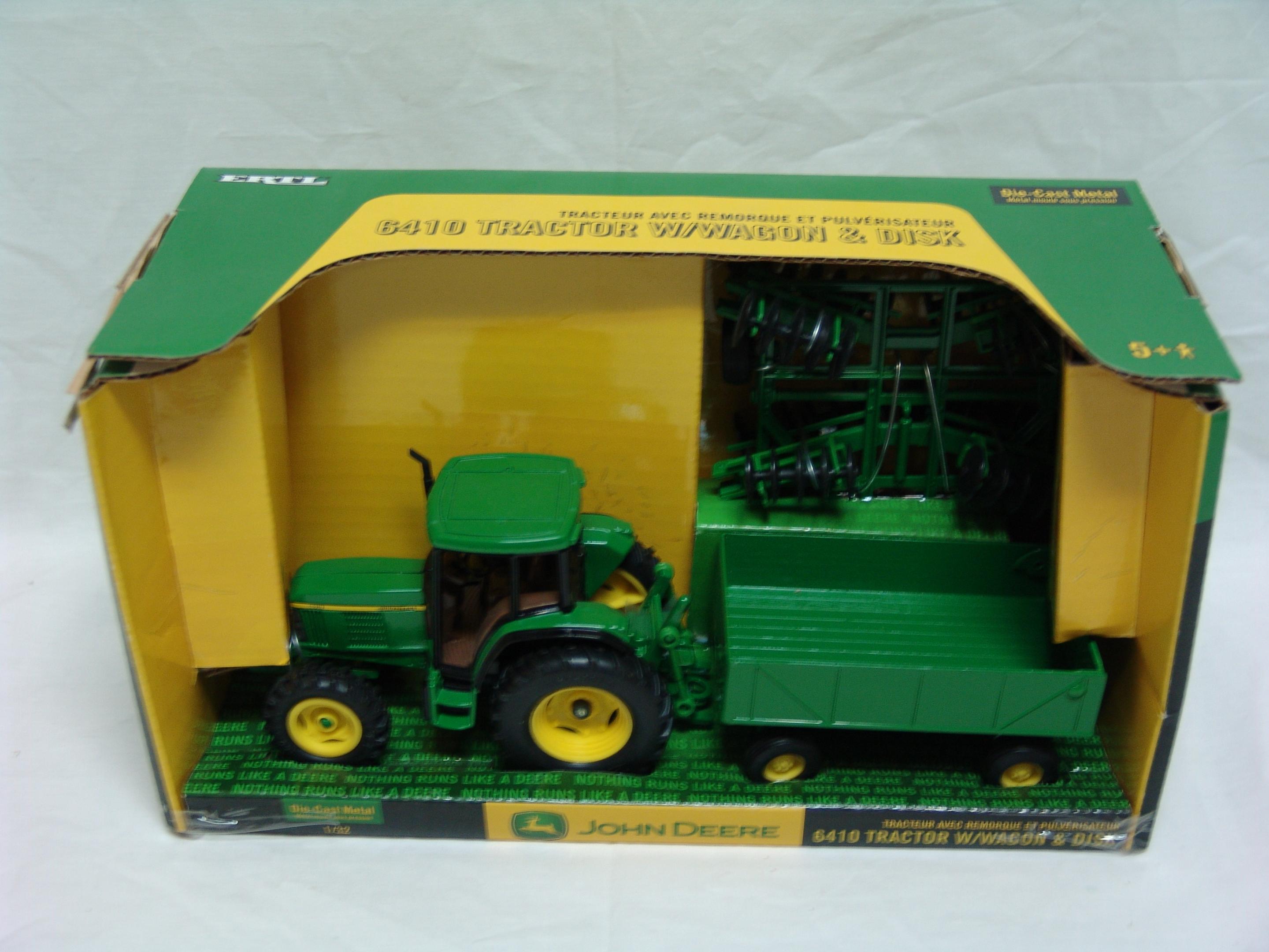 John Deere 6410 tractor with wagon & disk (used)