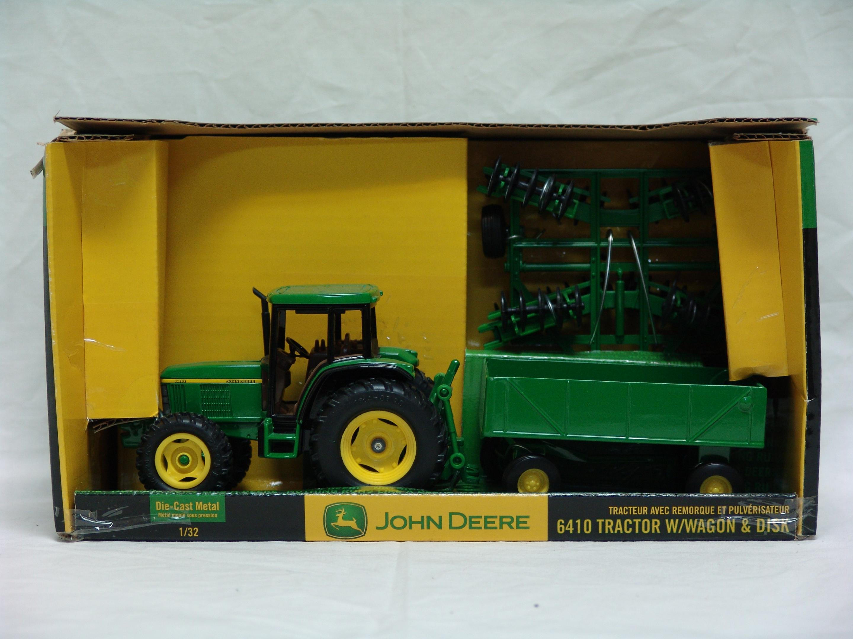 John Deere 6410 tractor with wagon & disk (used)