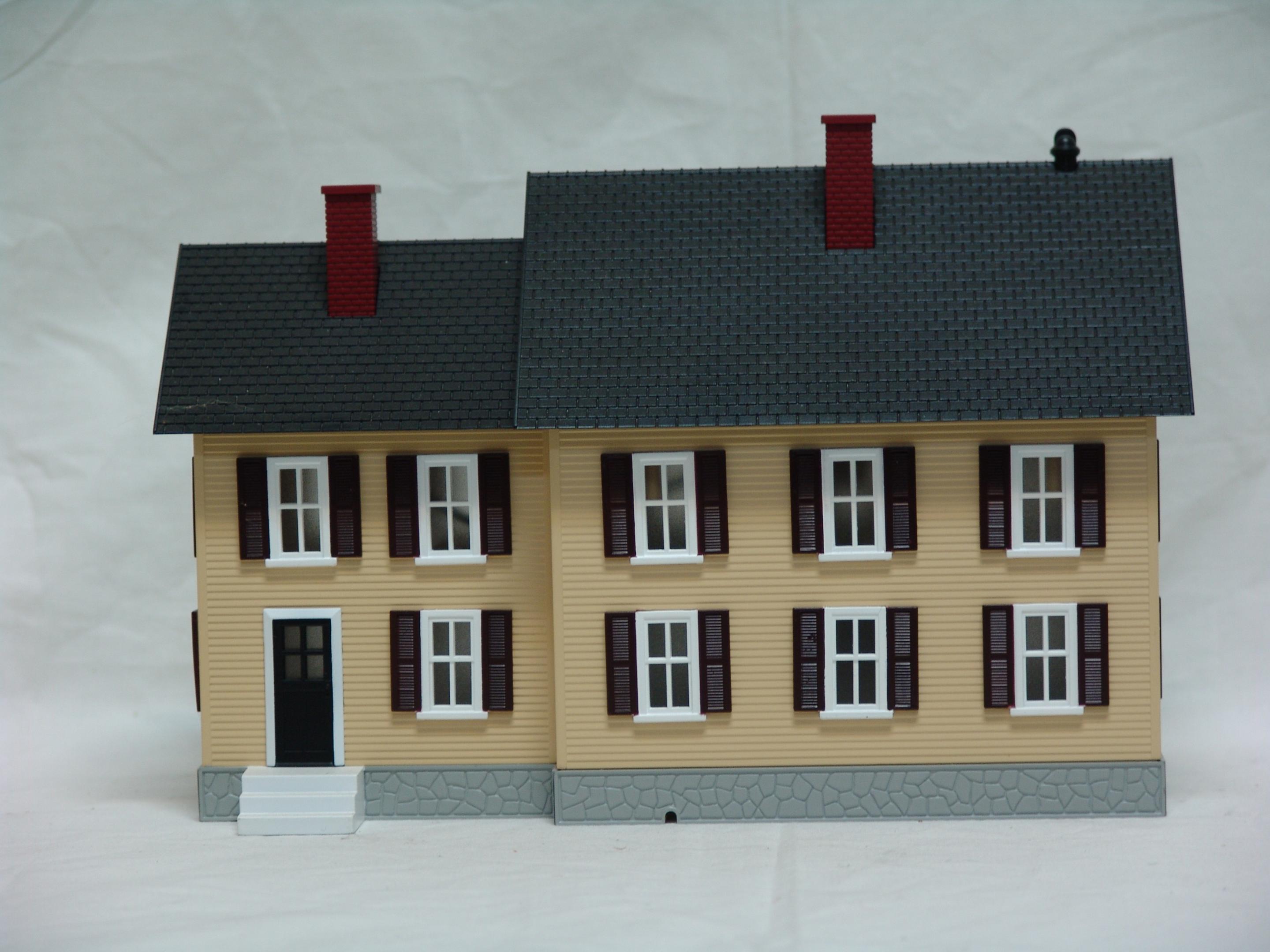 tan with dark brown shutters country house (used)