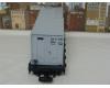 black flatcar #4069 with two containers (yellow box, used)
