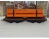 short flatcars with orange I-beam load (used)